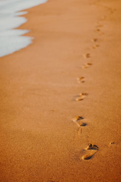 Consciously Living - Your NZ Wellness Directory - footsteps on beach